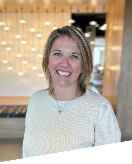 Smiling person in modern indoor space.