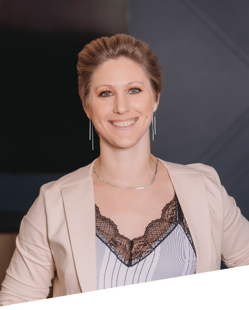 Smiling person in professional attire.